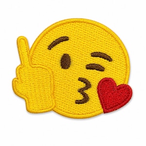 May include: A circular embroidered patch featuring a yellow emoji face with brown eyebrows and a brown mouth. The emoji has a raised hand showing a middle finger gesture and a red heart shape positioned over the lower right side of the face.