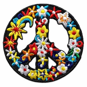 May include: A circular embroidered patch featuring a peace sign symbol. The design is composed of numerous small, colorful flowers in shades of yellow, red, white, and blue, stitched onto a black background that forms the peace sign shape.