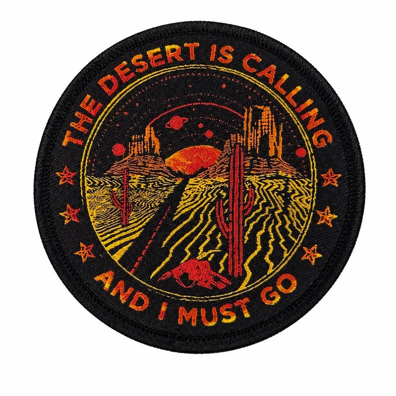 Round black woven patch with orange and red saguaro desert highway scene, moon, stars, and “The Desert Is Calling and I Must Go” lettering.