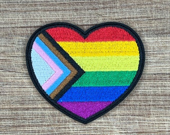 Progress Pride Heart Patch LGBTQ+ Rainbow Iron-On Embroidered 2.25&quot;, 4&quot; Vinyl Sticker & 1.25&quot; Enamel Pin Set – Heart Shape for Bags, Jackets