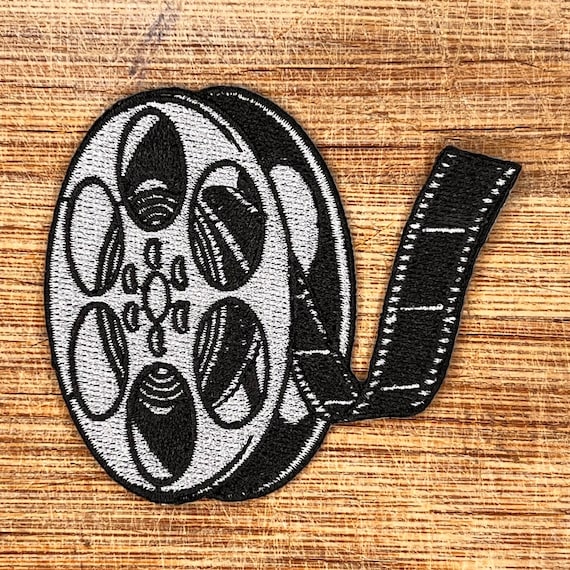 Vintage Film Reel Embroidered Patch – 3x2.5 Inch Iron-On Cinema Badge, Retro Movie Lover Gift, DIY Jacket Patch, Black & White