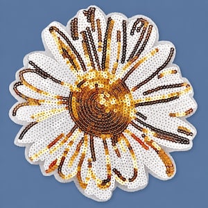 May include: A flower-shaped patch featuring white, gold, and dark brown sequins. The central disc is composed of dense dark brown and gold sequins, while the radiating petals are outlined and filled with white sequins and gold accents.