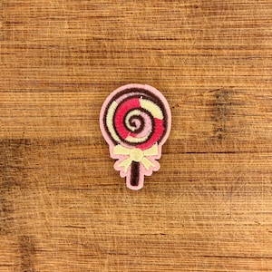 Parche de piruleta rosa con remolino, lazo, fieltro, aplique termoadhesivo de caramelo