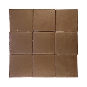 May include: Nine square brown tiles arranged in a 3x3 grid. The tiles have a matte finish and a consistent color, with slight variations in texture. The tiles are likely for flooring or wall applications.