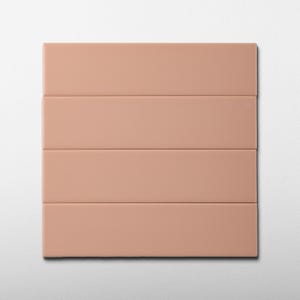May include: A rectangular, peach-colored panel with four horizontal sections. The panel has a smooth, matte finish and is set against a white background. The design is simple and modern, suitable for various interior design applications.