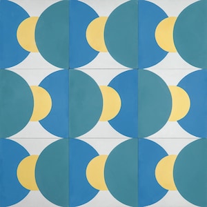 May include: A pattern of overlapping circles in yellow, teal, and blue on a white background. The circles are arranged in a repeating pattern, creating a geometric design.