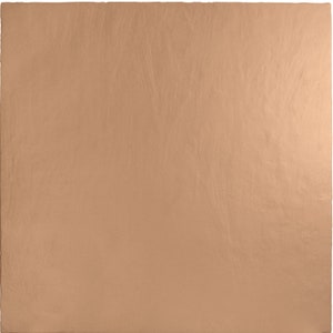May include: A square, copper-colored sheet with a textured surface. The sheet has a matte finish and appears to be made of metal. The color is a warm, earthy tone, and the surface has subtle variations in texture.