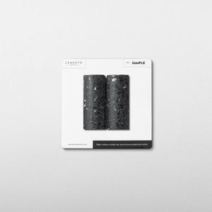 May include: A set of three ceramic mugs with a speckled, matte finish. The mugs are in shades of cream, light gray, and dark gray. Each mug has a simple, minimalist design, perfect for coffee or tea.