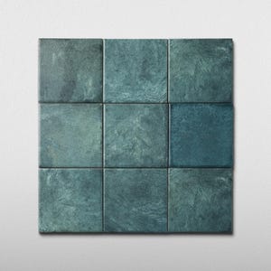 May include: Nine square tiles arranged in a 3x3 grid. The tiles have a mottled, textured appearance with shades of teal and blue-green. The tiles are set against a plain white background.