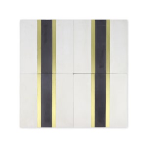 May include: Four white ceramic tiles with black and gold stripes. The tiles are arranged in a 2x2 grid.