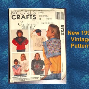 May include: A vintage McCall's Crafts pattern from 1993, featuring designs for creative clothing. The cover displays images of various garments, including sweaters and tops. The text "New 1993 Vintage Pattern" is visible.