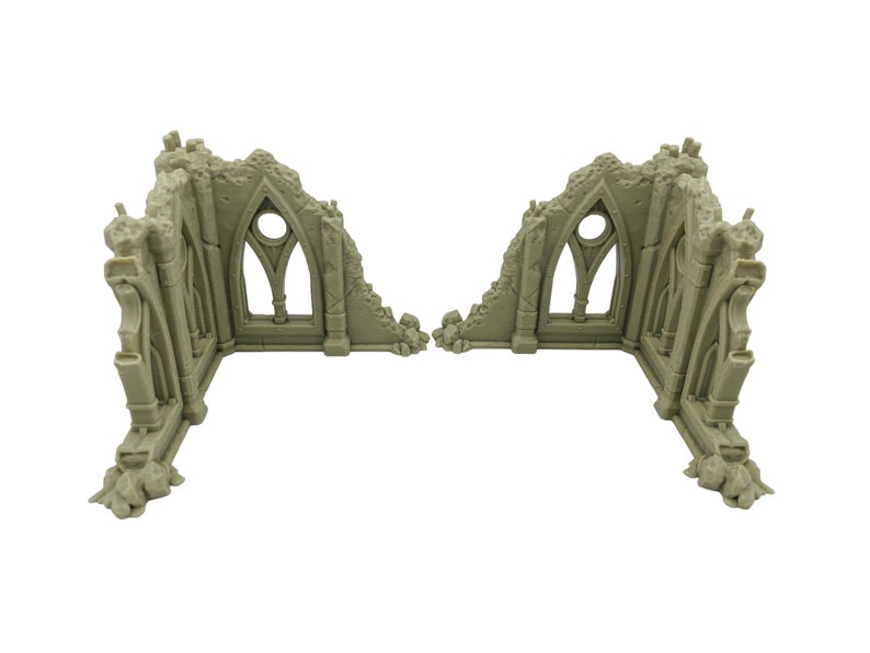 May include: Two beige, L-shaped miniature wall sections featuring gothic-style architecture with pointed arches, circular window cutouts, and jagged, broken edges that simulate a ruined building structure for tabletop gaming.
