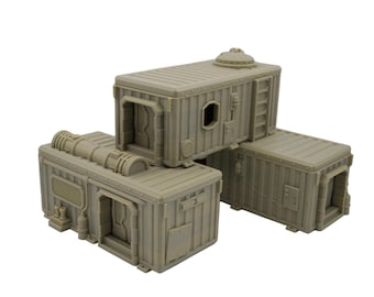 May include: A collection of modular, tan-colored, industrial-style structures. The structures feature doors, windows, and detailed exterior elements like pipes and ladders. The design suggests a futuristic or sci-fi theme, suitable for tabletop gaming or model building.