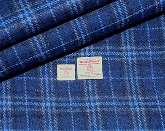 May include: Blue and white plaid Harris Tweed fabric with two Harris Tweed labels. The labels are white with black text and a red logo.