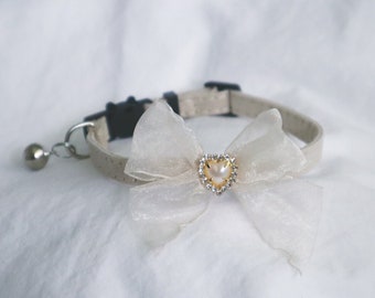 The Elena Collar in cream - romantic cat collar with a large cream ribbon bow and a gold pearl heart rhinestone small pet collar