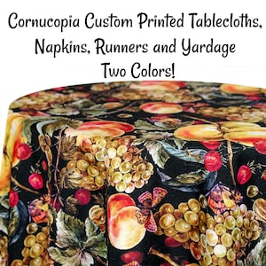 May include: A black tablecloth with a watercolor print of peaches, grapes, and butterflies. The tablecloth is available in two colors. Cornucopia Custom Printed Tablecloths, Napkins, Runners and Yardage Two Colors!