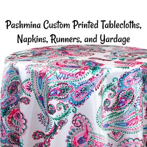 May include: White tablecloth with a paisley pattern in shades of pink, green, and blue. The tablecloth is made of a soft, luxurious fabric and is perfect for adding a touch of elegance to any event.