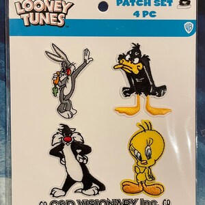 May include: A Looney Tunes patch set featuring Bugs Bunny, Daffy Duck, Sylvester the Cat, and Tweety Bird. The patches are colorful, embroidered, and packaged on a white card with the Looney Tunes logo and "PATCH SET 4 PC" text.