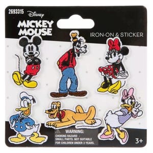 May include: A set of six Disney Mickey Mouse iron-on and sticker patches on a black and white backing card. The characters include Mickey Mouse, Goofy, Minnie Mouse, Donald Duck, Pluto, and Daisy Duck, all rendered in their classic colors.