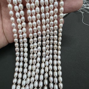 Newly Listed ~~~ Natural Pink Fresh Water Pearls ~~~ 5x7 mm ~~~ Rice Shape ~~~1 Strand~~~ 13 inches ~~55 Beads in 1 strand-- Wholesale price