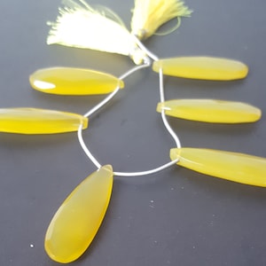 Newly Listed---Yellow Chalcedony---- Faceted Long Pear Shape Beads-----1 Strand----179 Carat----6 Pieces--- Side Drilled-----14-35 MM