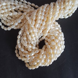 Newly Listed---- Natural Fresh Water Pearl---Rice Shape Pearl---5 mm----13 inches ---AAA Quality~~~~ 55 Beads in1 strand