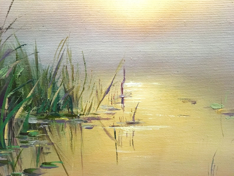 May include: A painting of a still pond with tall green reeds on the left side of the image. The water is a light yellow color and reflects the sky, which is a light blue and yellow color. The sun is shining brightly in the sky, and the water is calm and still.