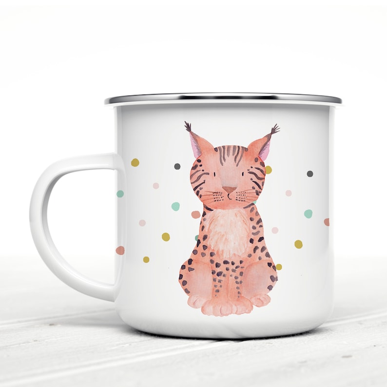May include: White enamel mug with a colourful spotted pattern and a watercolour illustration of a lynx sitting on a white background.