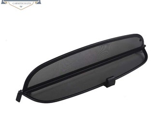 May include: Black mesh car window wind deflector with a black metal frame. The deflector is designed to be installed in the rear window of a convertible car.
