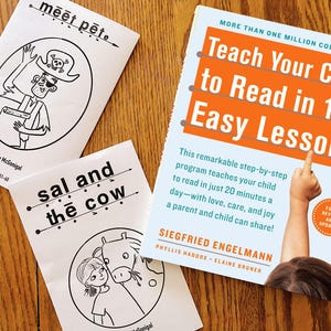 May include: Educational resources for children, featuring a book titled "Teach Your Child to Read in 100 Easy Lessons" and two booklets with illustrations and text. The book has orange and white text. The booklets have black and white illustrations.