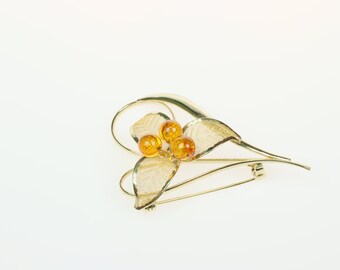 broszka  kwiatowa z bursztynem bałtyckim  "lilia"