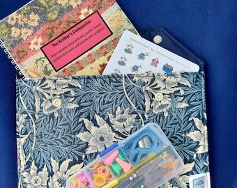 Knitting travel kit including cotton pouch, knitting project book, knitting stickers, pencil and notions kit.