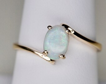 Classic Opal Cabochon Bypass Ring in 10k Yellow Gold, AJ, 10K Plumb, Oval, Solitaire, Size 7.5+ (7 1/2+), c. 1980s, 2.27g