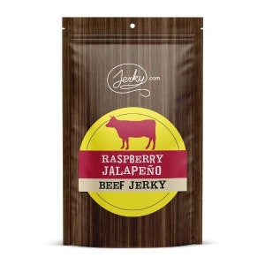 May include: A brown paper bag with a woodgrain pattern. The bag has a yellow circle with a red cow silhouette and the text "Raspberry Jalapeño Beef Jerky" in red and white. The top of the bag has a white circle with the text "Jerky.com" in black.