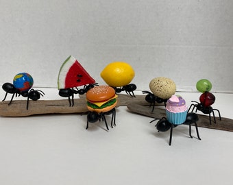 Fake ants and watermelon tiered tray, world, hamburger cupcake, grapes, lemon and egg. Tiered tray fake food. Spring Summer Picnic.