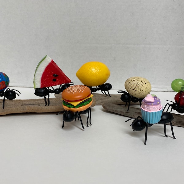 Fake ants and watermelon tiered tray, world, hamburger cupcake, grapes, lemon and egg. Tiered tray fake food. Spring Summer Picnic.