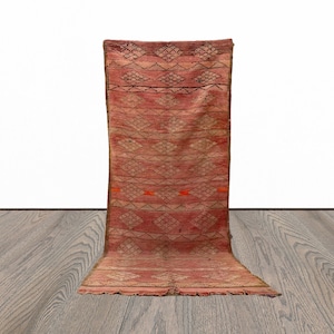 Narrow flat weave tribal 4x10 runner rug.