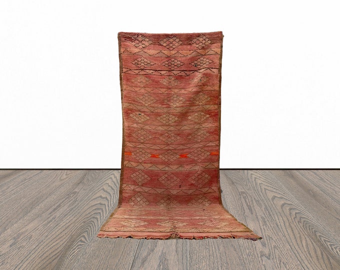 Narrow flat weave tribal 4x10 runner rug.