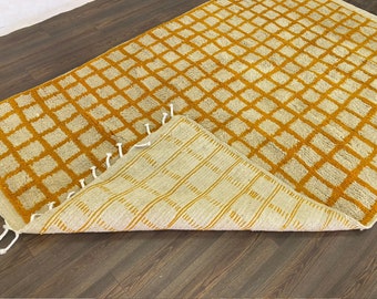 Moroccan orange and white grid area rug!