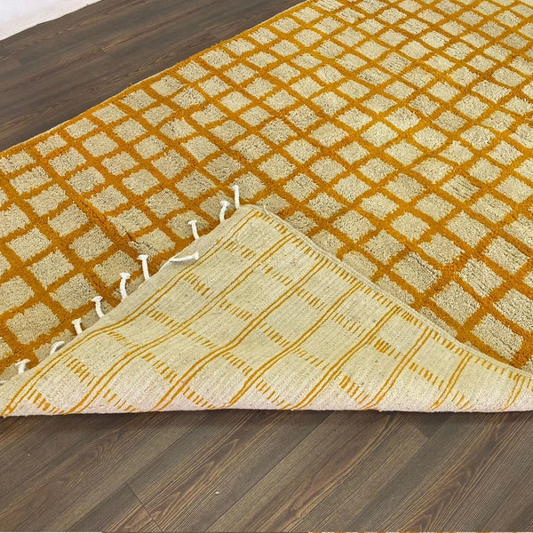Moroccan orange and white grid area rug!