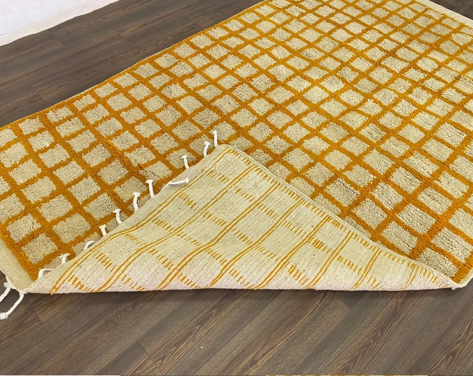 Moroccan orange and white grid area rug!