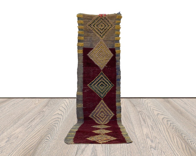 2 ft by 10 ft Moroccan Vintage runner Rug.