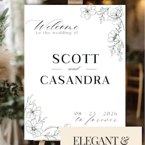 Puede incluir: Un letrero de bienvenida de boda blanco sobre un caballete. El letrero presenta las palabras "Welcome to the wedding of SCOTT and CASANDRA" en una escritura elegante. También se incluyen dibujos lineales florales y la fecha "08-23-2026". El letrero también dice "ELEGANT & CUSTOMIZABLE DESIGN".