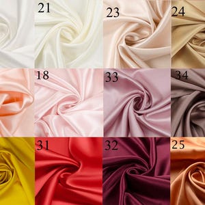 May include: A collection of 10 fabric swatches in various colors, including white, cream, peach, pink, brown, yellow, red, burgundy, and orange. The fabric is a smooth, silky satin.
