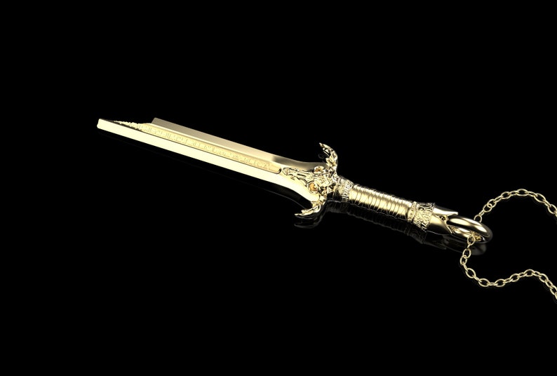 May include: A gold sword pendant necklace with a detailed design and a chain.