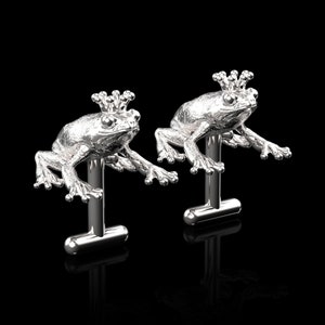 May include: A pair of silver frog cufflinks, each frog is wearing a crown.