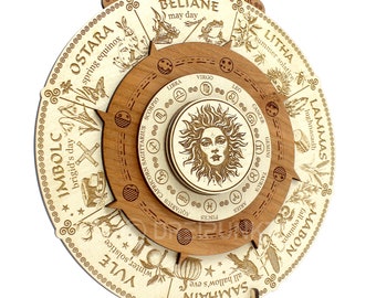 May include: A circular wooden Wheel of the Year calendar featuring engraved text and illustrations for seasonal festivals like Yule, Imbolc, Ostara, Beltane, Litha, Lammas, Mabon, and Samhain. The center displays zodiac signs and a sun face design.