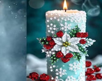 May include: A cylindrical light blue candle with a lit flame, decorated with white snowflake patterns, a central white poinsettia flower, and clusters of red berries and green leaves. The candle surface features a textured, beaded appearance.