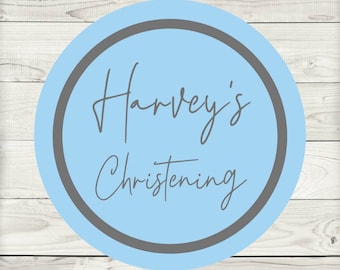 May include: A light blue circle with a gray border and the text "Harvey's Christening" in gray script.