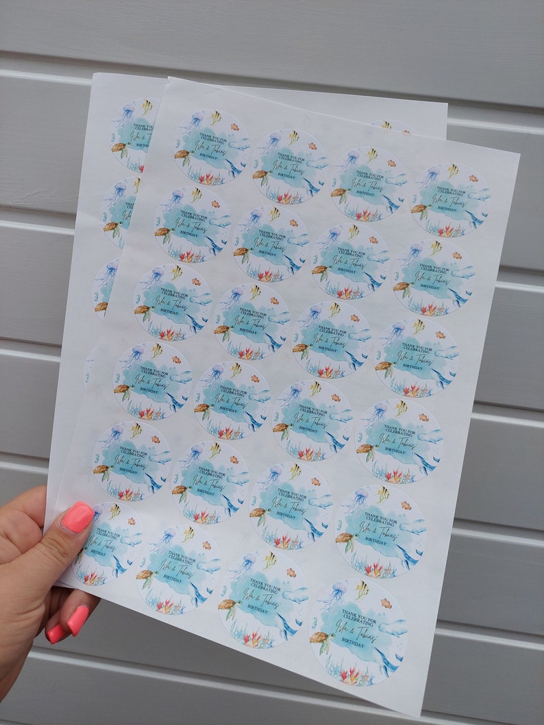 May include: A sheet of stickers with a watercolor design of a turtle, jellyfish, and coral reef. The stickers say "Thank you for celebrating John & Thomas' Birthday".
